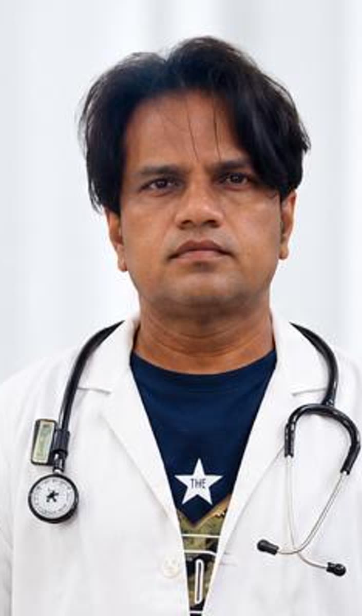 Prof. Dr. Sak Uroof Rahamathullah maxillofacial surgeon in white coat